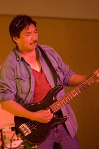 Henry Tobac playing his guitar.