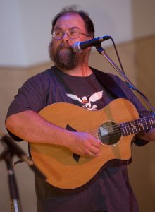 Steve Slade playing his guitar.