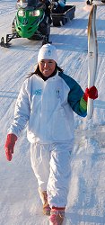 Erika Tizya-Tramm walking with olympic torch