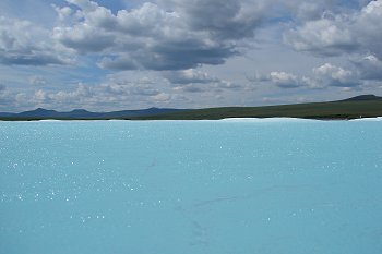 Some crystal clear water on top of the ice, also know as aufeis.
