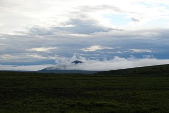 Some fog passing by the mountain.