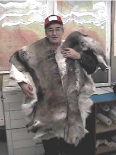 Stephen Frost Sr. in L/R Dept. Displays Caribou Skins
