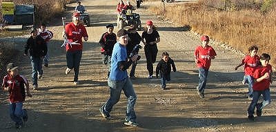 One of the photographers, Chris Siddall runs ahead of the runners to get the money shot