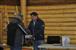 Chief Joe Linklater presenting gift of appreciation to Heritage Committee member Robert Bruce Jr. The gift is a digital photo frame featuring photos of their numerous trips interviewing Elders throughout the Vuntut Gwitchin traditional territory.