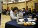 RCMP Constable Karen Olito picking up ''People of the Lakes'' copies for the Old Crow RCMP members.