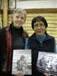 Shirleen Smith and Mary Jane Moses holding ''People of the Lakes'' and the Elders photo album.