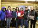 Elder Dick Nukon, Marion Schafer, Mary Jane Moses, Megan Williams, Jane Montgomery, Robert Bruce Jr., and Shirleen Smith with ''People of the Lakes'' and Elders photo album.
