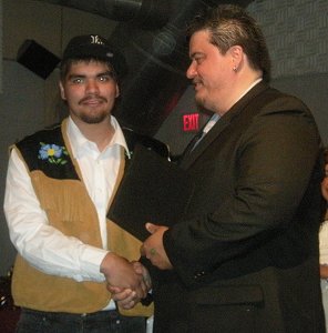 VGFN Jacob Huebschwerlen shaking hands with the Grand Chief.