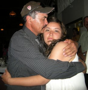 A proud loving hug from dad.